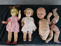 Three 20th century articulated limbed dolls, two of which clothed. H.50 W.26 largest