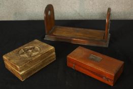 A 19th century mahogany and brass book slide, together with a cased hydrometer and a carved box. H.