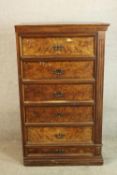 A late 19th century walnut five drawer tallboy with brass swing handles raised on plinth base. H.142