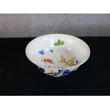 A 20th century Japanese porcelain bowl, the interior decorated with butterflies in a garden and