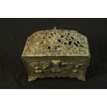 A 19th century, possibly Chinese brass box and cover, the lid with pierced decoration and the base