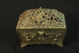 A 19th century, possibly Chinese brass box and cover, the lid with pierced decoration and the base