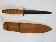 WWII British Fairbairn Sykes commando knife with wooden handle. With an 'x' cut into the handle by