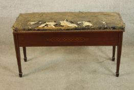 An Edwardian inlaid mahogany duet piano stool raised on square tapering supports terminating in