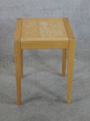 A 20th beech framed square occassional table raised on tapering supports. H.51 W.38 D.38cm