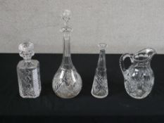 A 20th century cut glass decanter and stopper, together with two other decanters and stoppers (one