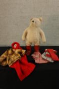 A vintage Paddington Bear complete with assortment of clothes. H.50cm.
