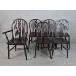 A set of six 20th century stained beech wheel and spindle back Windsor type dining chairs
