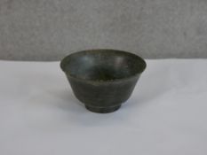 A small Chinese turned jadite/jade bowl raised on circular foot. H.6 W.9 D.9cm