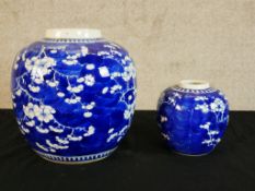 Two 19th century Chinese blue and white porcelain jars decorated with prunus flowers, each with four