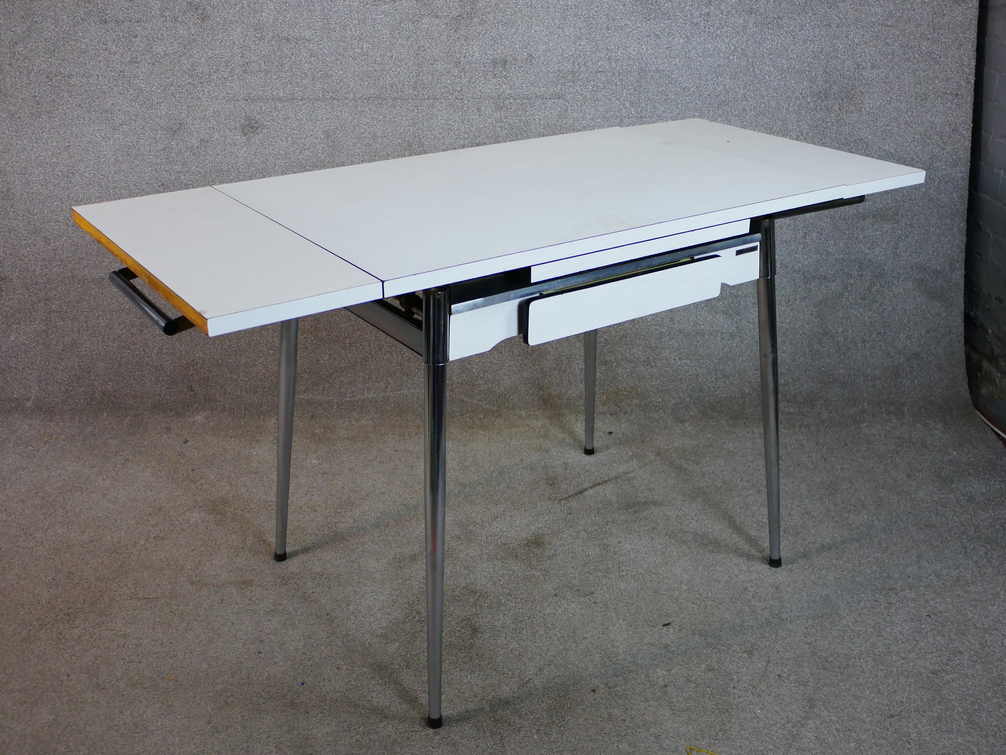 A mid 20th century Supamatic formica drawleaf dining table raised on chrome plated supports - Image 2 of 5