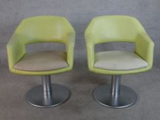 Two late 20th century Swedish Johanson design revolving armchairs upholstered in lime fabric