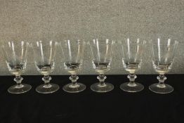 A set of six early 20th century drinking glasses, the conical bowl etched with a horse and rider