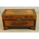 An early 20th century carved Chinese blanket chest raised on shaped shaped bracket feet. H.50 W.