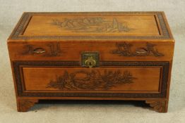 An early 20th century carved Chinese blanket chest raised on shaped shaped bracket feet. H.50 W.