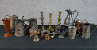 Assorted brass and other metalware to include candlesticks, jugs and other items. H.29 W.12 D.12cm