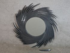 A contemporary grey painted spiral effect wooden framed wall mirror. Some damage. H.105 W.105cm