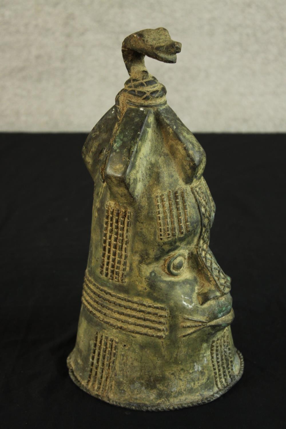 A Japanese possibly Edo period cast bronze bell modelled in the form of a stylised head. H.36cm. - Image 3 of 4