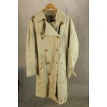 A modern gentlemens Burberry trench coat, with original label.