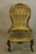 A 19th century mahogany framed upholstered spoon back ladies nursing chair with buttoned back