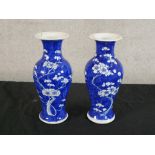 A pair of late 19th/early 20th century Chinese blue and white porcelain baluster vases, each