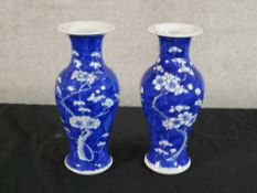 A pair of late 19th/early 20th century Chinese blue and white porcelain baluster vases, each