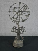 A late 19th/early 20th century African bronze Tree of Life sculpture raised on circular base. H.43