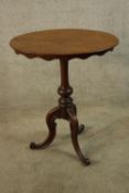 A late 19th century oval topped occassional table, the turned central column raised on three