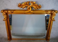 A 19th century carved and gilt painted overmantle mirror, with acanthus leaf decoration. H.110 W.