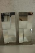 A pair of contemporary multi faceted rectangular wall mirrors. H.102 W.42cm. (each)