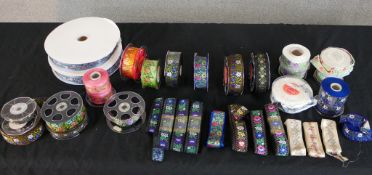 A large collection of approximately 33m of Danish embroidered silk folk costume ribbon, different