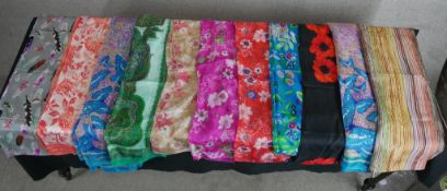 Eleven assorted vintage patterned silk scarves.