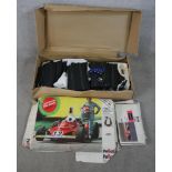 A mid 20th century boxed Scalextric Postril car racing set complete with instruction manual.W.100