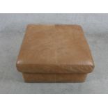 A contemporary square brown leather footstool H.39 W.76 D.76cm