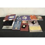 Assortment of late 20th century British coin proof sets, complete with packaging and some