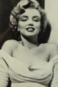 A framed black and white photograph of Marilyn Monroe. H.61 W.47cm.
