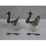 A pair of 20th silver mounted glass 'peacock' table salts and spoons. H.7 W.7 D.6.5cm