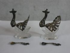 A pair of 20th silver mounted glass 'peacock' table salts and spoons. H.7 W.7 D.6.5cm
