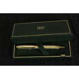 A boxed Cross Sterling silver rollerball pen with engine turned decoration. L.18cm.