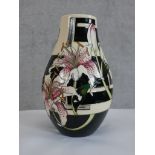 A Moorcroft Stargazer Lilly. Designed by Vicky Lovatt. Vase with a part mirrored finish. Signed '