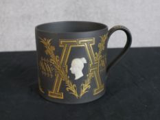A limited edition Wedgwood porcelain 'Victoria & Albert' tankard designed by Richard Guyatt to