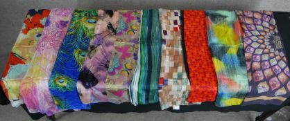 Ten assorted vintage patterned silk scarves.