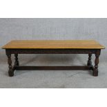 A 19th century carved oak refectory style bench with plank seat. H.30 W.92 D.30cm
