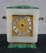An Art Deco marble and malachite Sewell of London mantle clock, with engraved brass and silvered