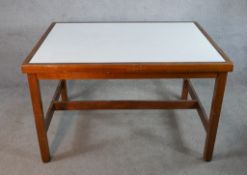teak mid century table with a white glass top surface. H.75 x W.122 x D.92 cm.