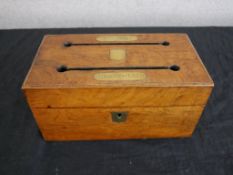 A Georgian style walnut and brass twin section desk top correspondence box, the hinged lid opening