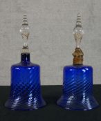 A pair of late 19th century blue glass bells each with turned clear glass handles (pendants missing)
