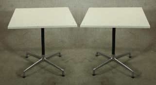 A pair of mid 20th century Charles & Ray Eames Vitra Contract square topped tables, each raised on