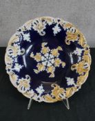 A 19th century Meissen porcelain shallow dish, the bowl painted with cobalt blue with white and gold