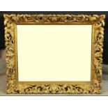 A 19th century carved giltwood Florentine wall mirror. H.81 W.87cm.